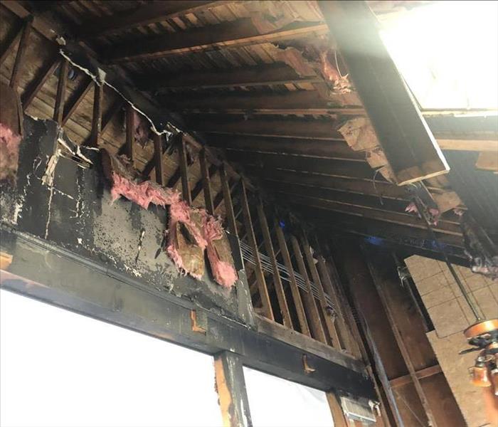 the interior of a home stripped down to studs due to fire damage